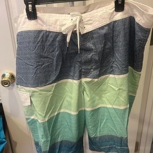 Old Navy Mens 10” Board Shorts at the knee.